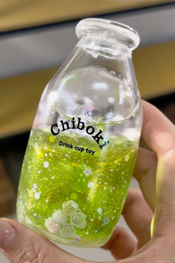 Lime green glitter drink bottle squishy toy